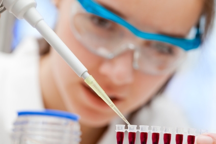 Lab technician pipetting samples