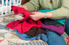 woman folding clothes